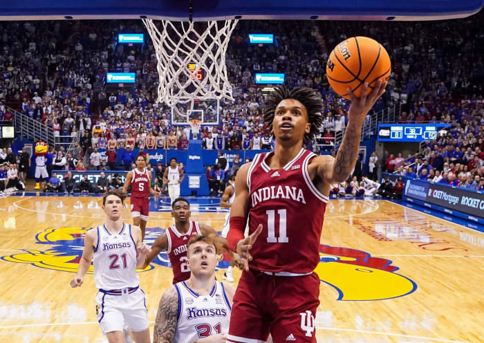 Indiana Hoosiers guard CJ Gunn (11) shoots a layup against Kansas Jayhawks forward Cam Martin (31) during the second half at Allen Fieldhouse.